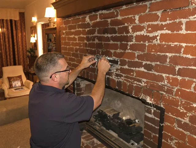 Rocky River Chimney Sweep expert fixing a fireplace in Rocky River, OH